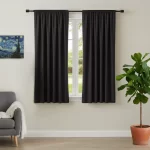 black rod pocket curtain hanging on window