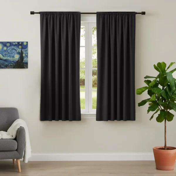 black rod pocket curtain hanging on window