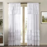 white ruffle top curtain hanging on a door